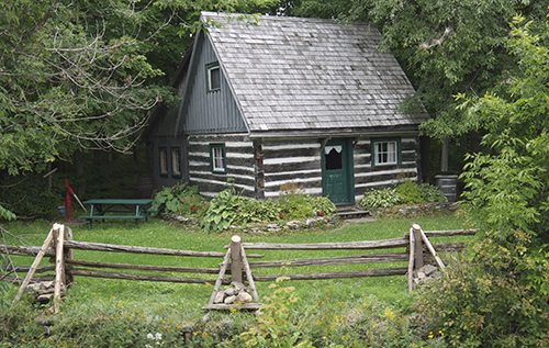 Central Manitoulin Historical Society - Current Pioneer Log Cabin with Rail Fence